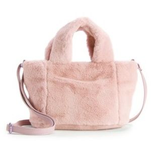 Plush pink crossbody purse with adjustable straps